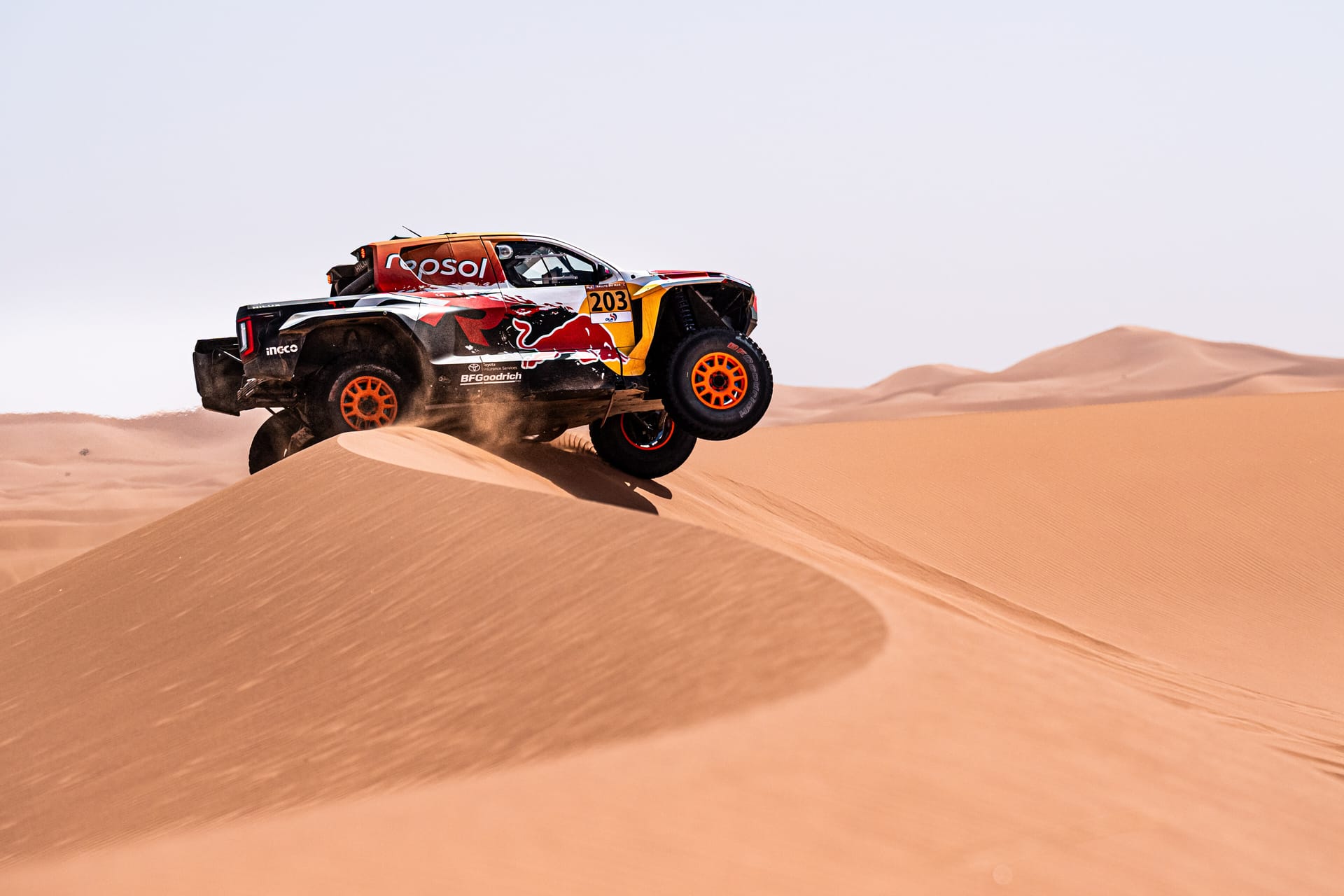 Seth Quintero’s Toyota Hilux cresting a sand dune in Morocco