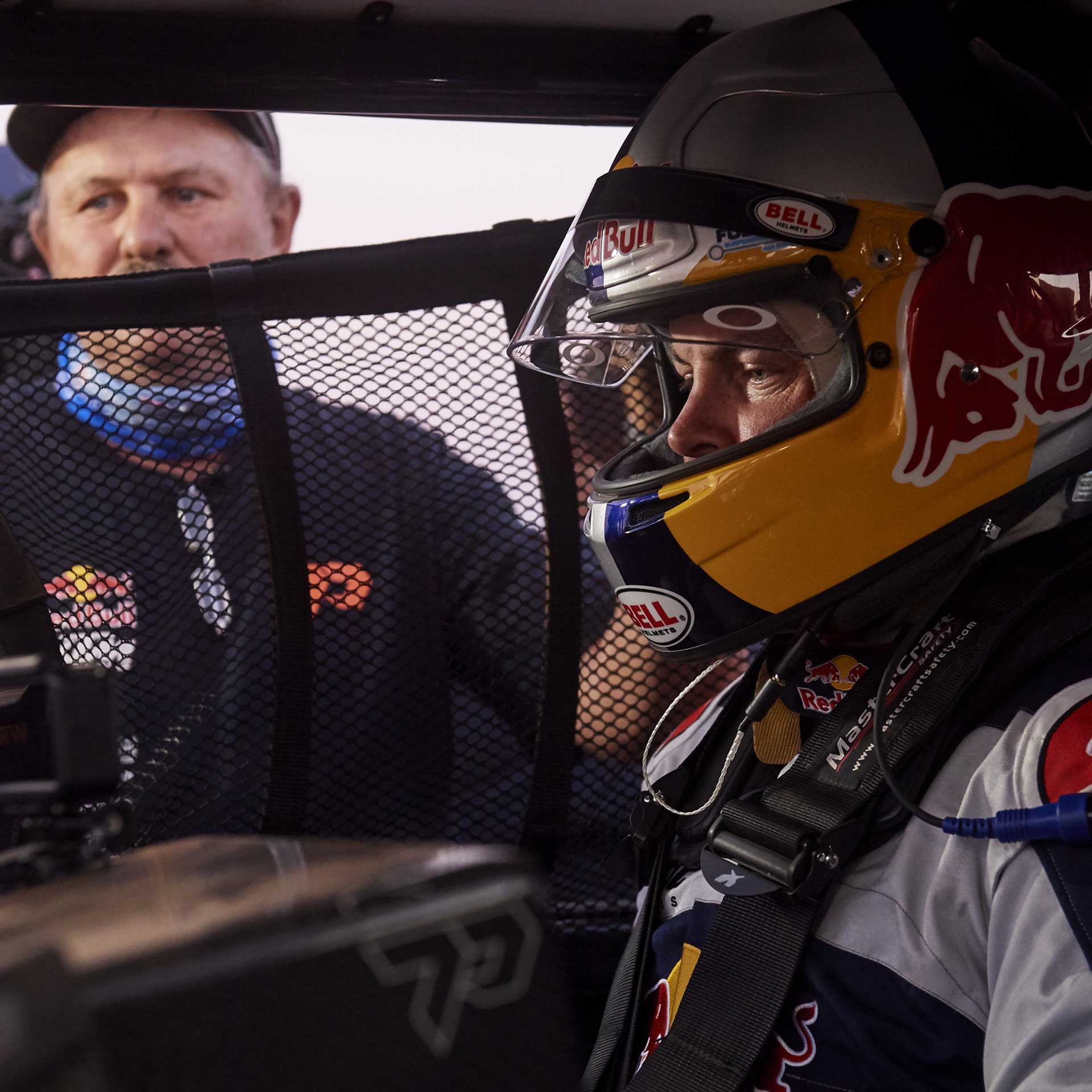 Toby Price helmeted in the Trophy Truck cockpit