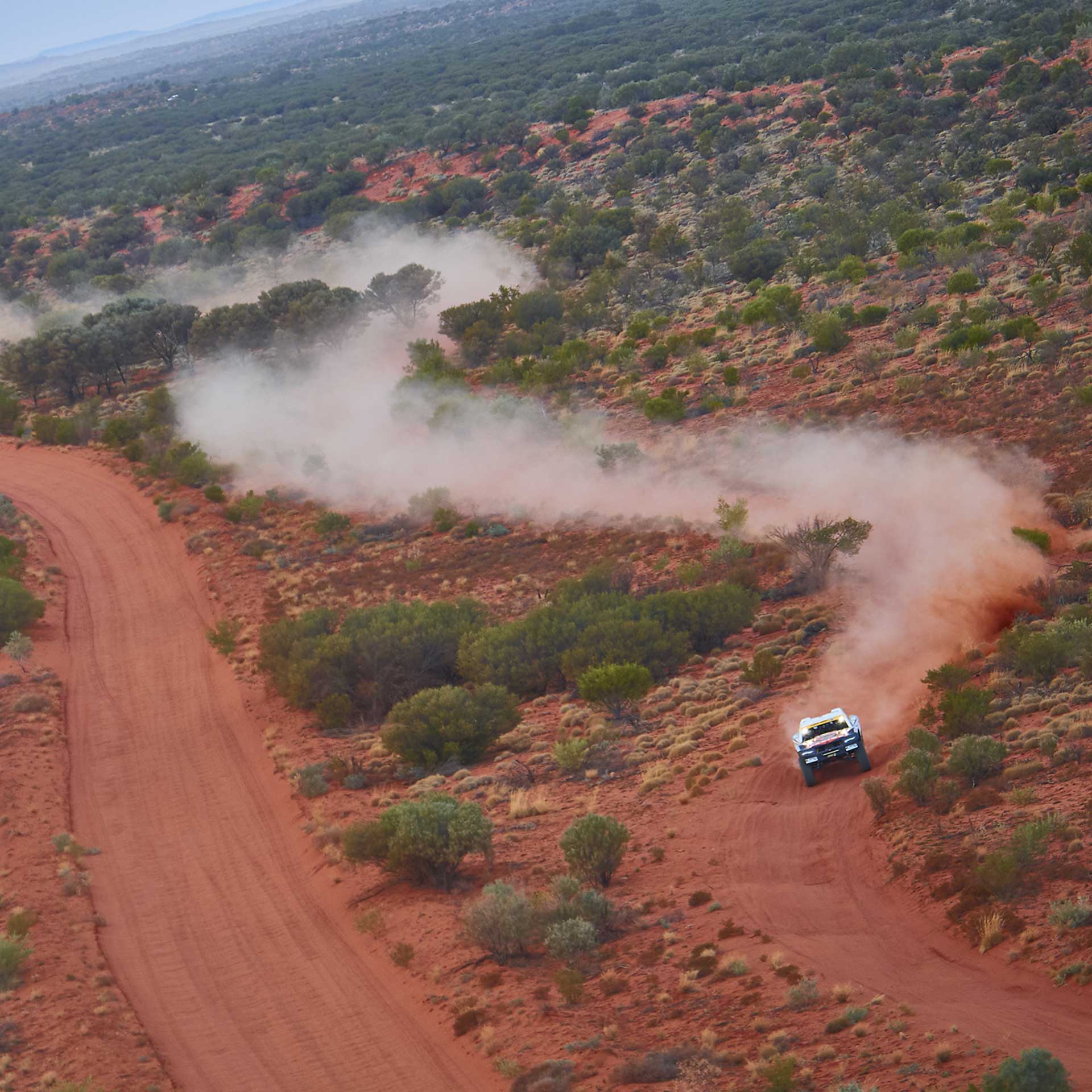 Aerial view of the Trophy Truck raising dust on the Finke Track