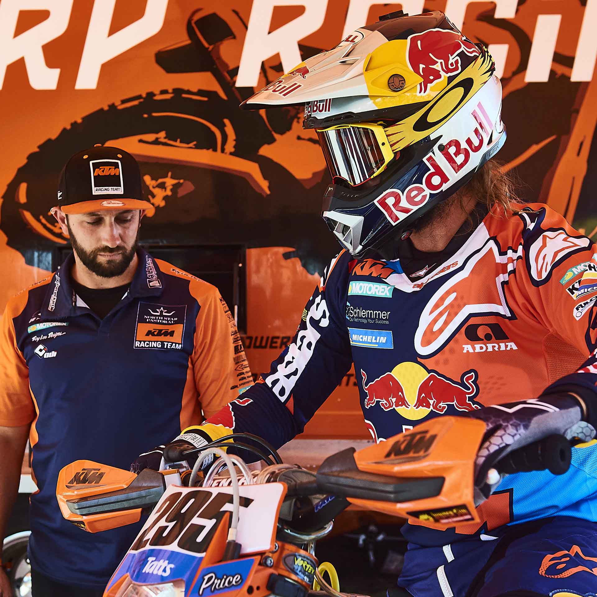 Toby Price on the bike with his KTM crew