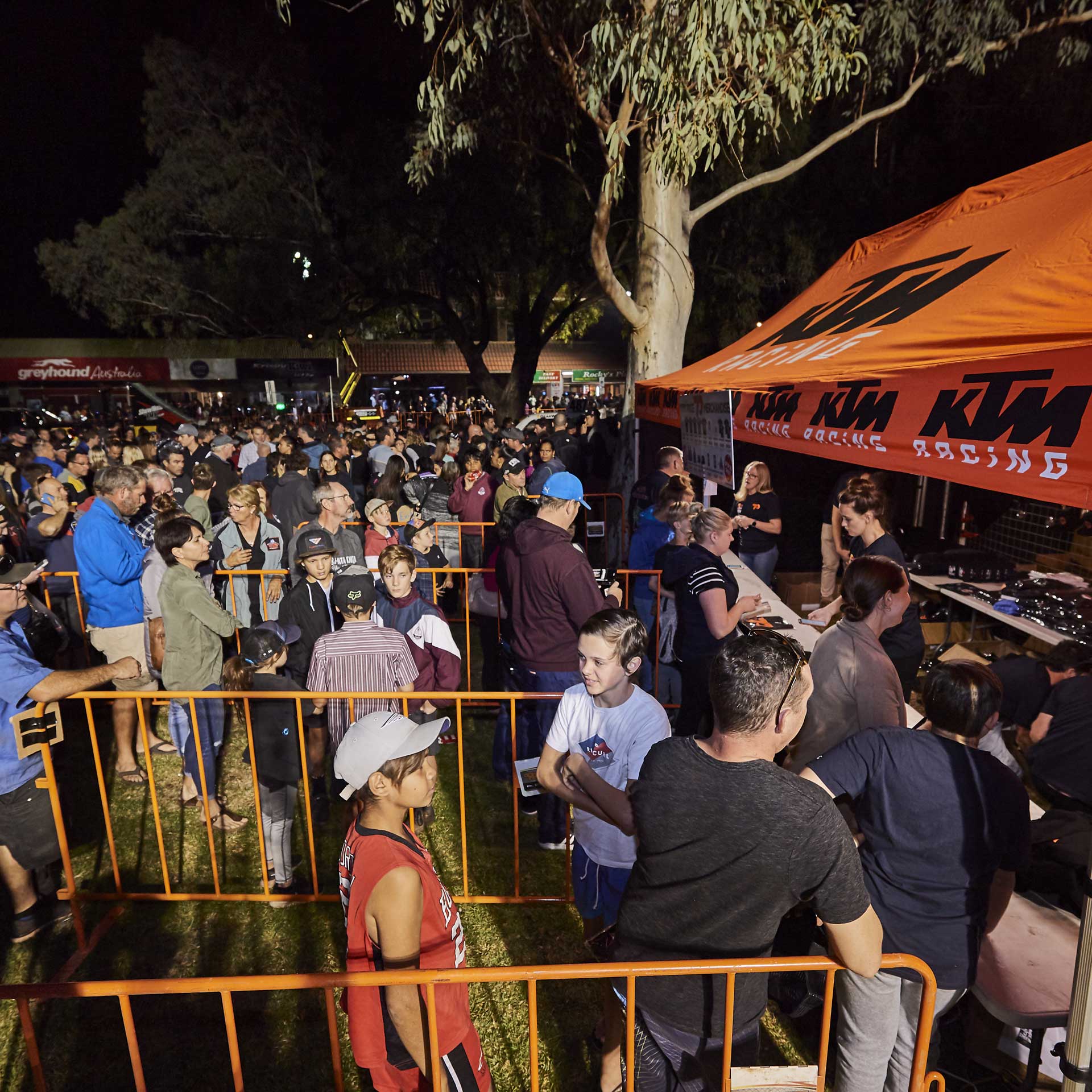 Fans crowding the merchandise stand at the Thursday Night Street Party