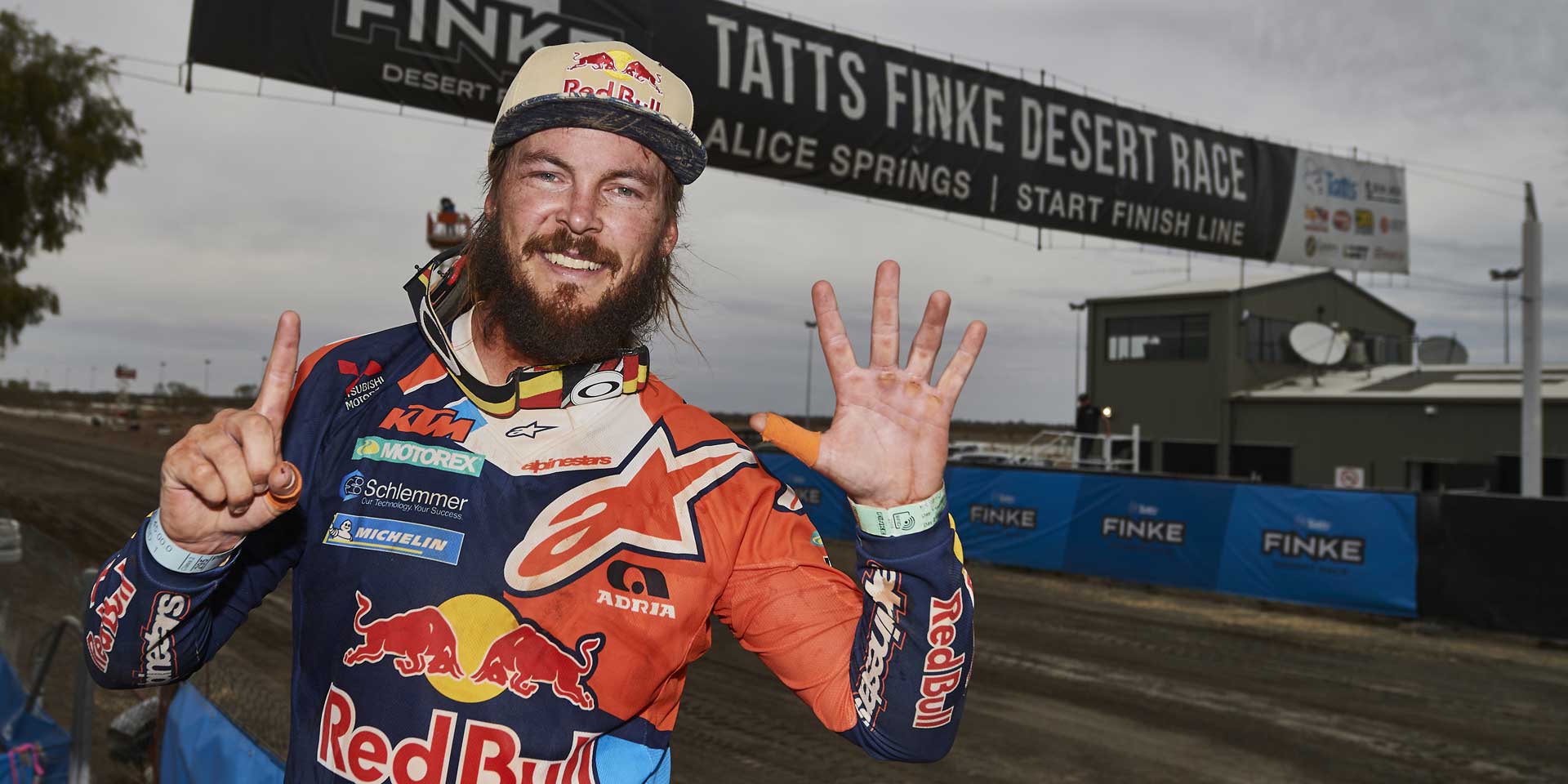 Toby Price celebrating his record sixth Finke Desert Race win