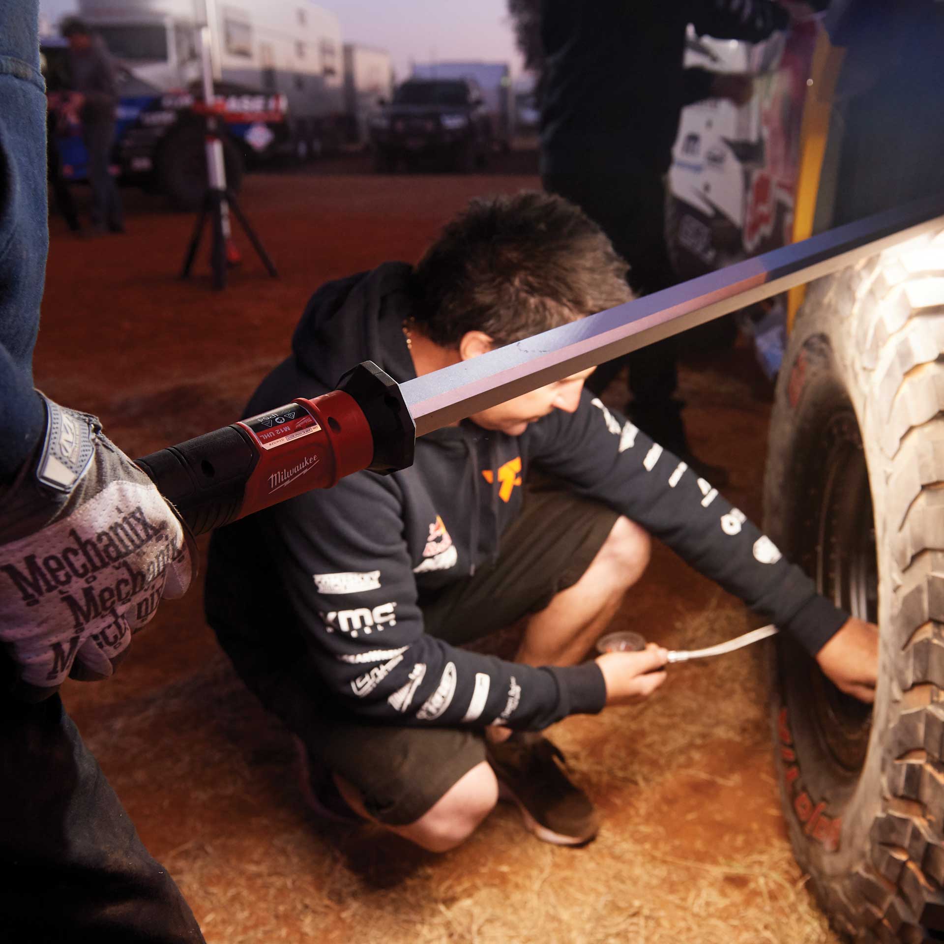 Mechanic preparing the Trophy Truck's wheel