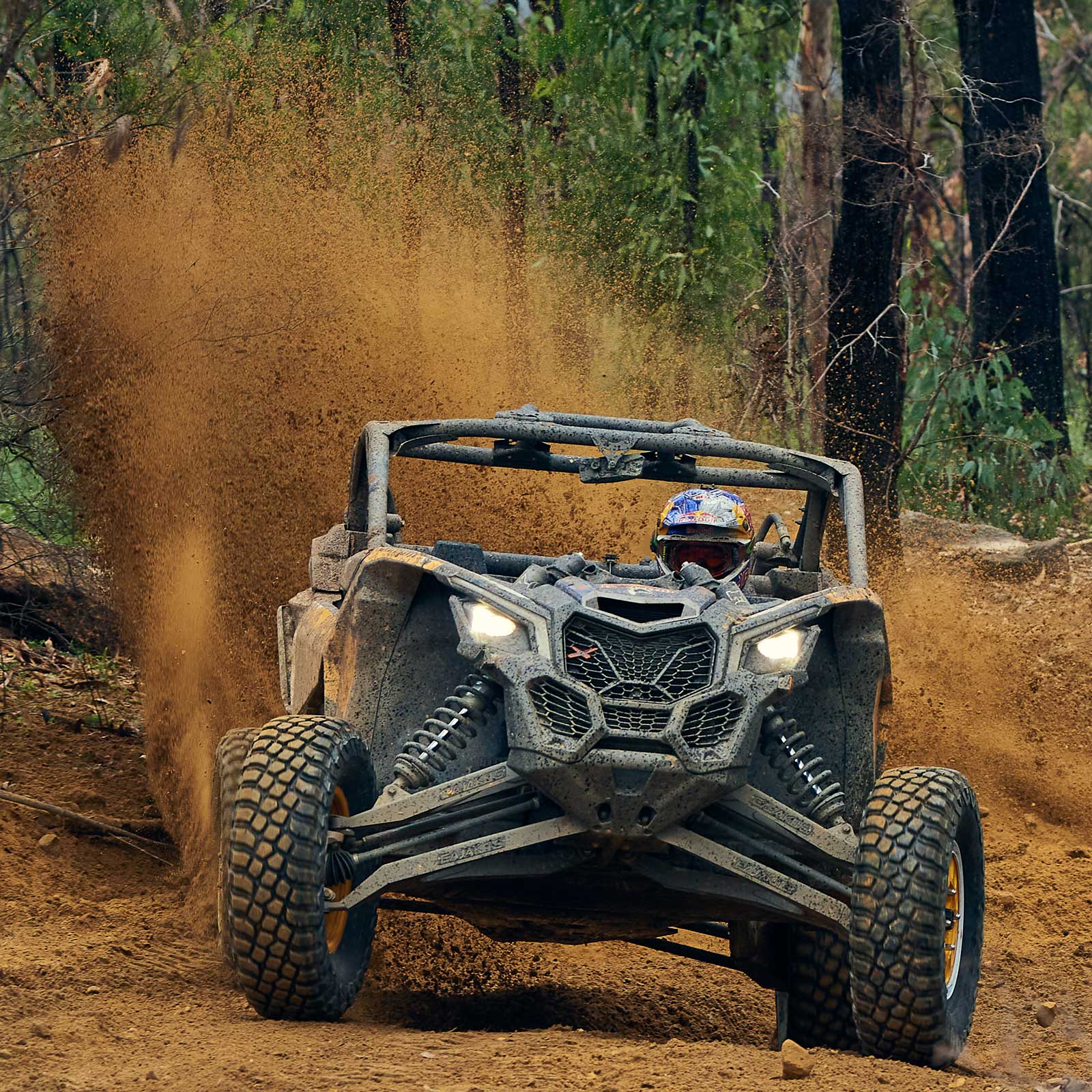 Can-Am Maverick X3 kicking up dirt on a bush track