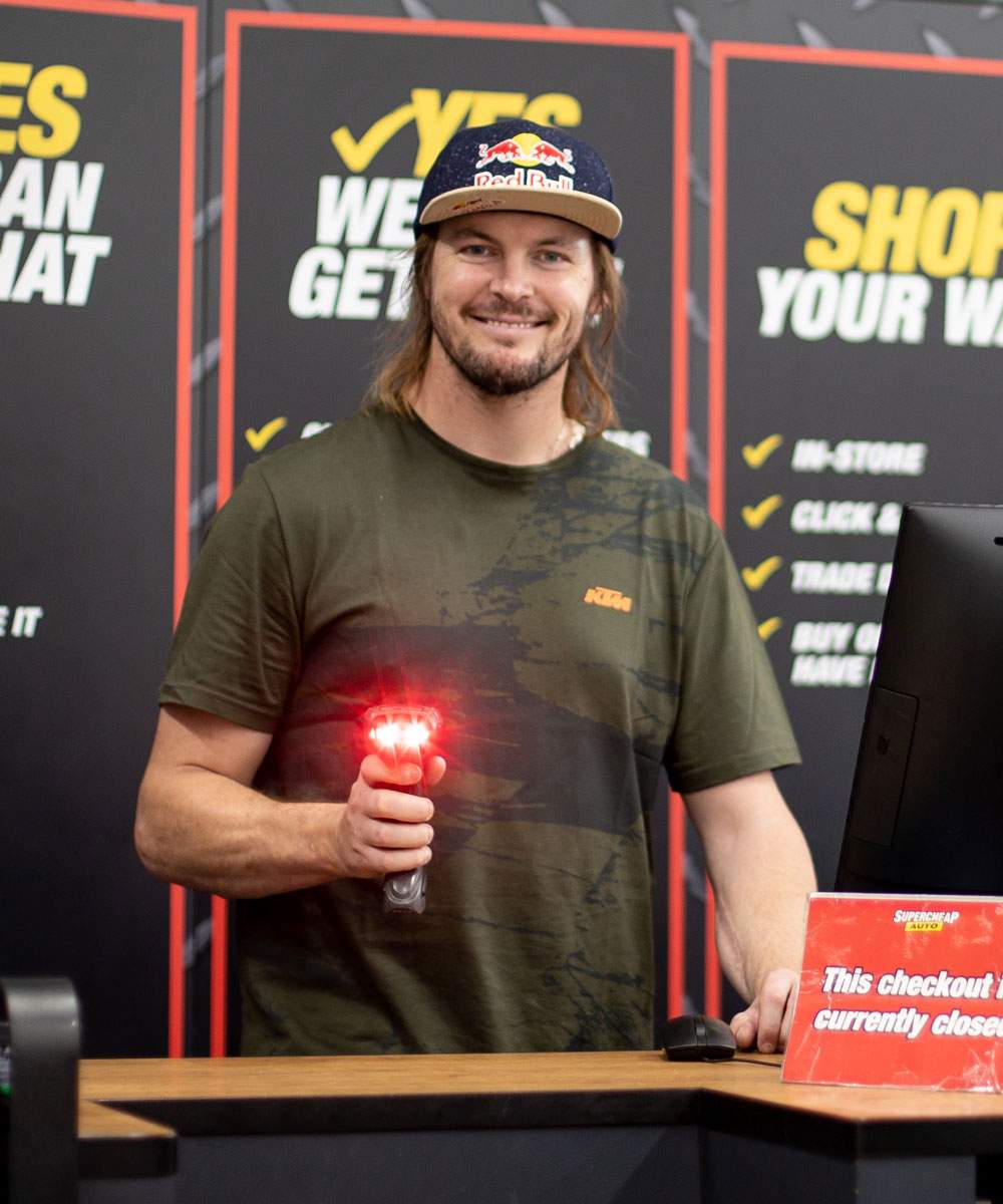 Toby Price at the checkout during the in-store campaign