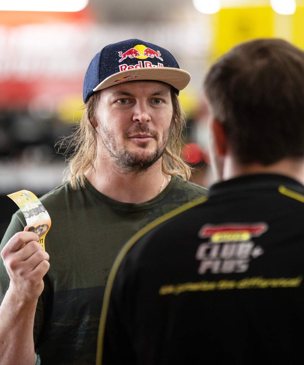 Toby Price meeting a Club Plus member during the in-store activation