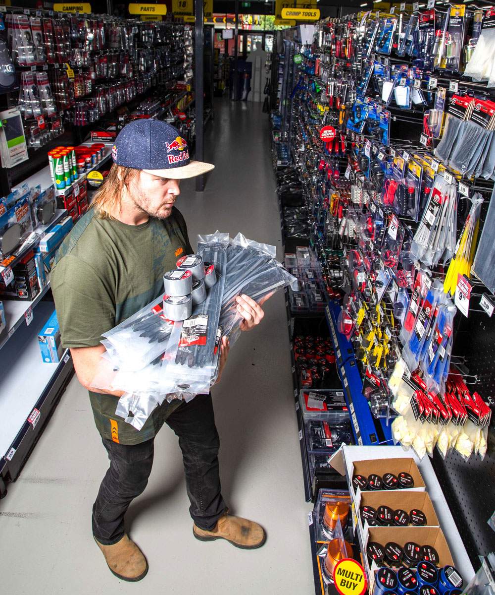 Toby Price shopping the aisles of a Supercheap Auto store