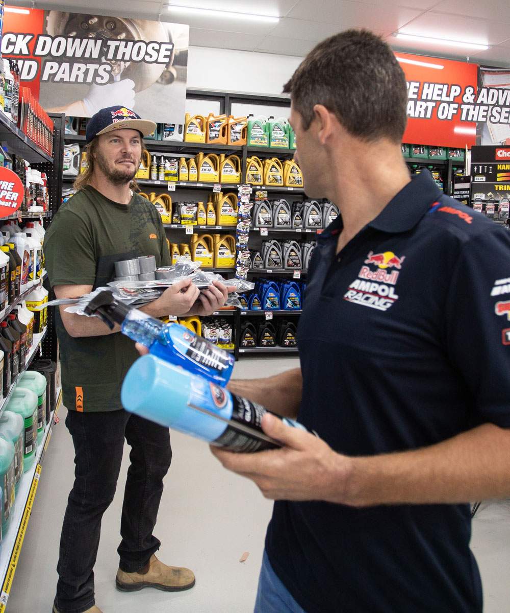Toby Price with a Red Bull team member in store