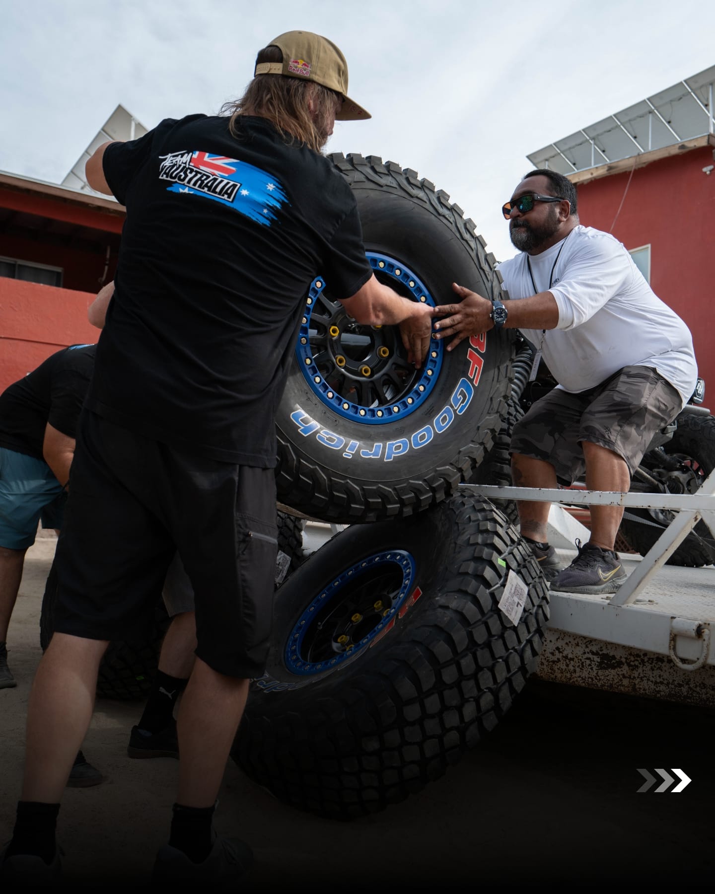 Team Australia crew changing tyres on a support trailer
