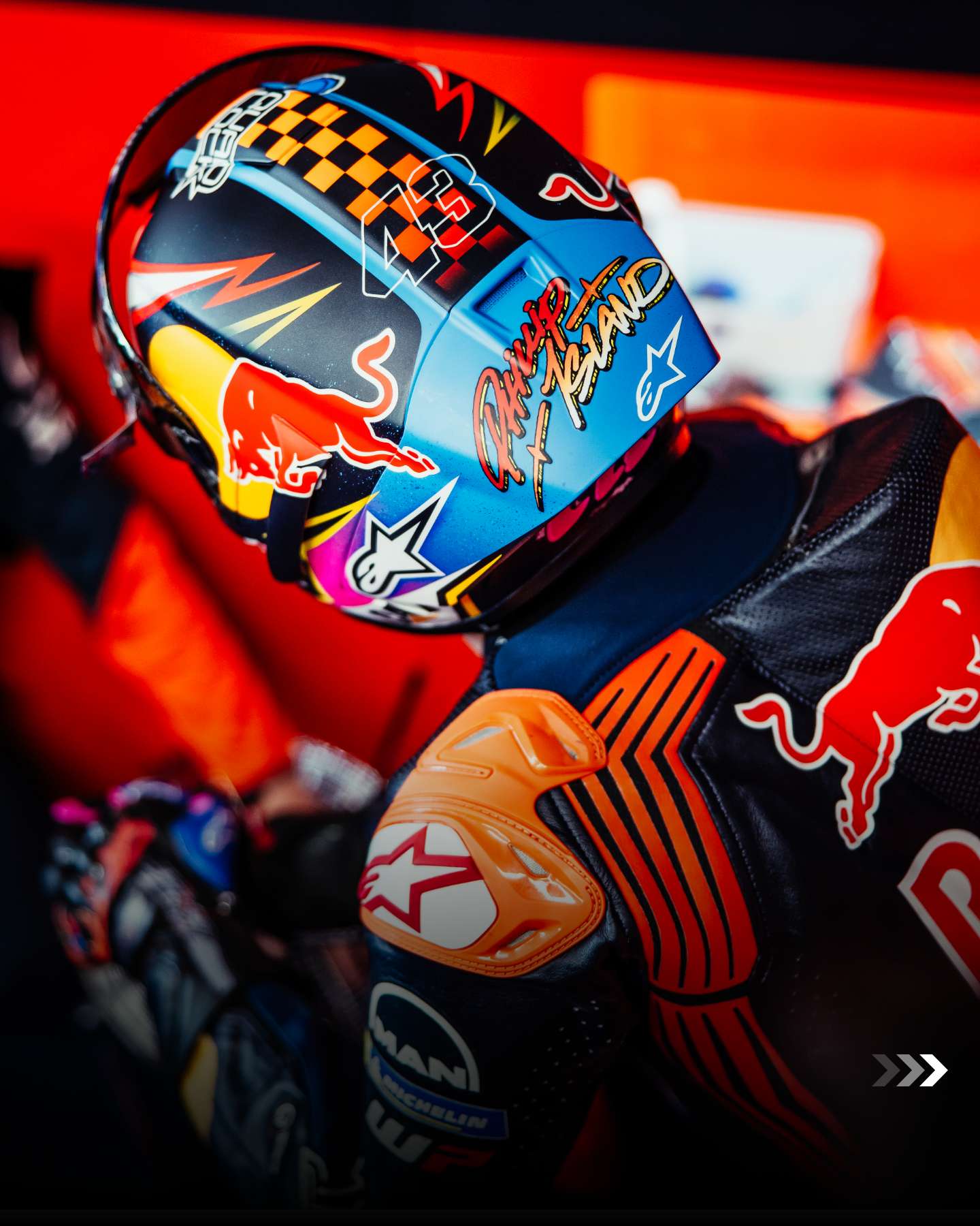 Jack Miller in the garage wearing the capsule range helmet