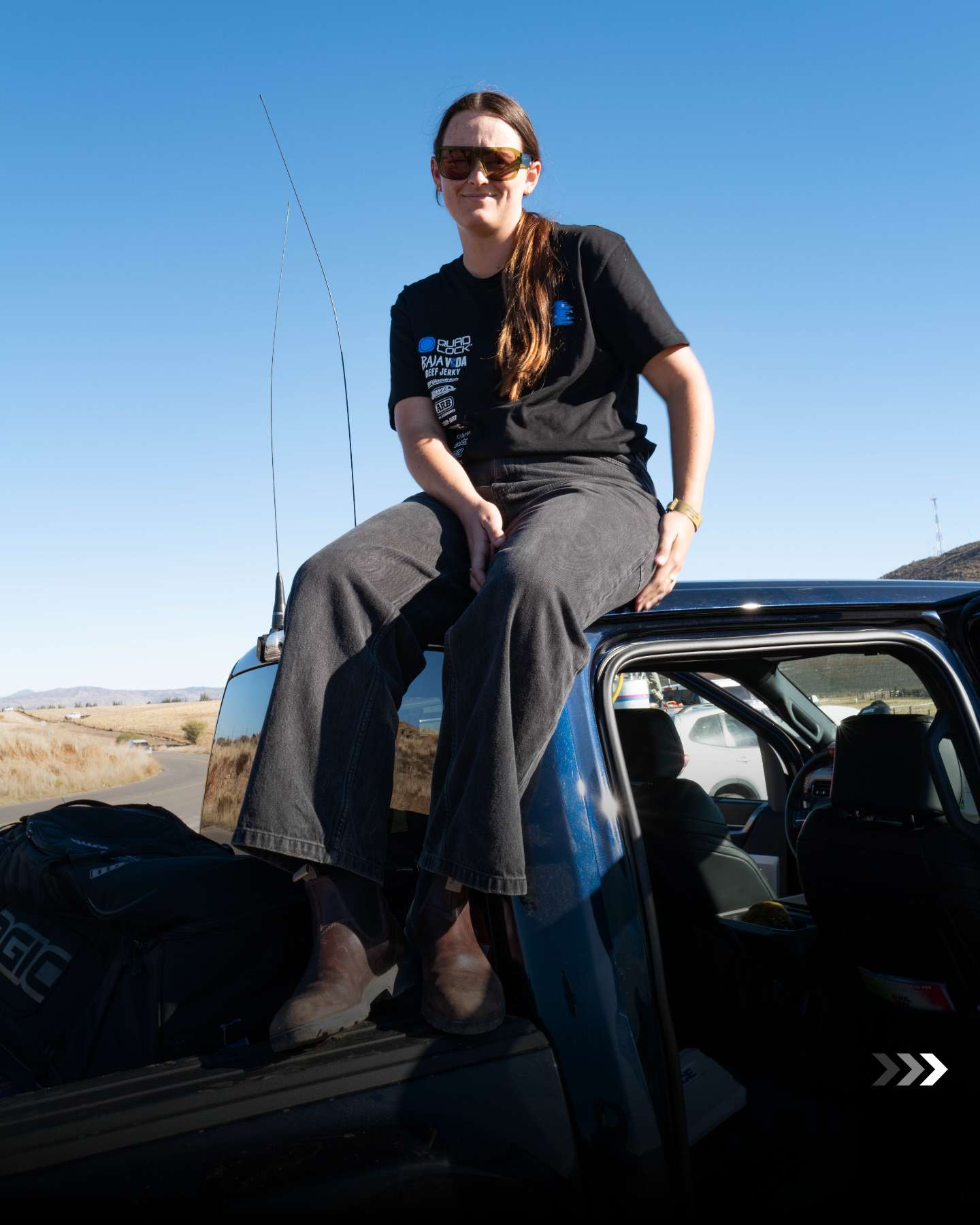 Team Australia crew member sitting on a support truck