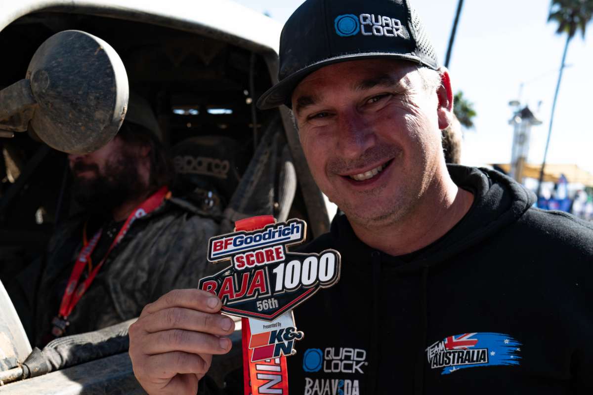 Team Australia celebrating with a SCORE Baja 1000 finisher sticker
