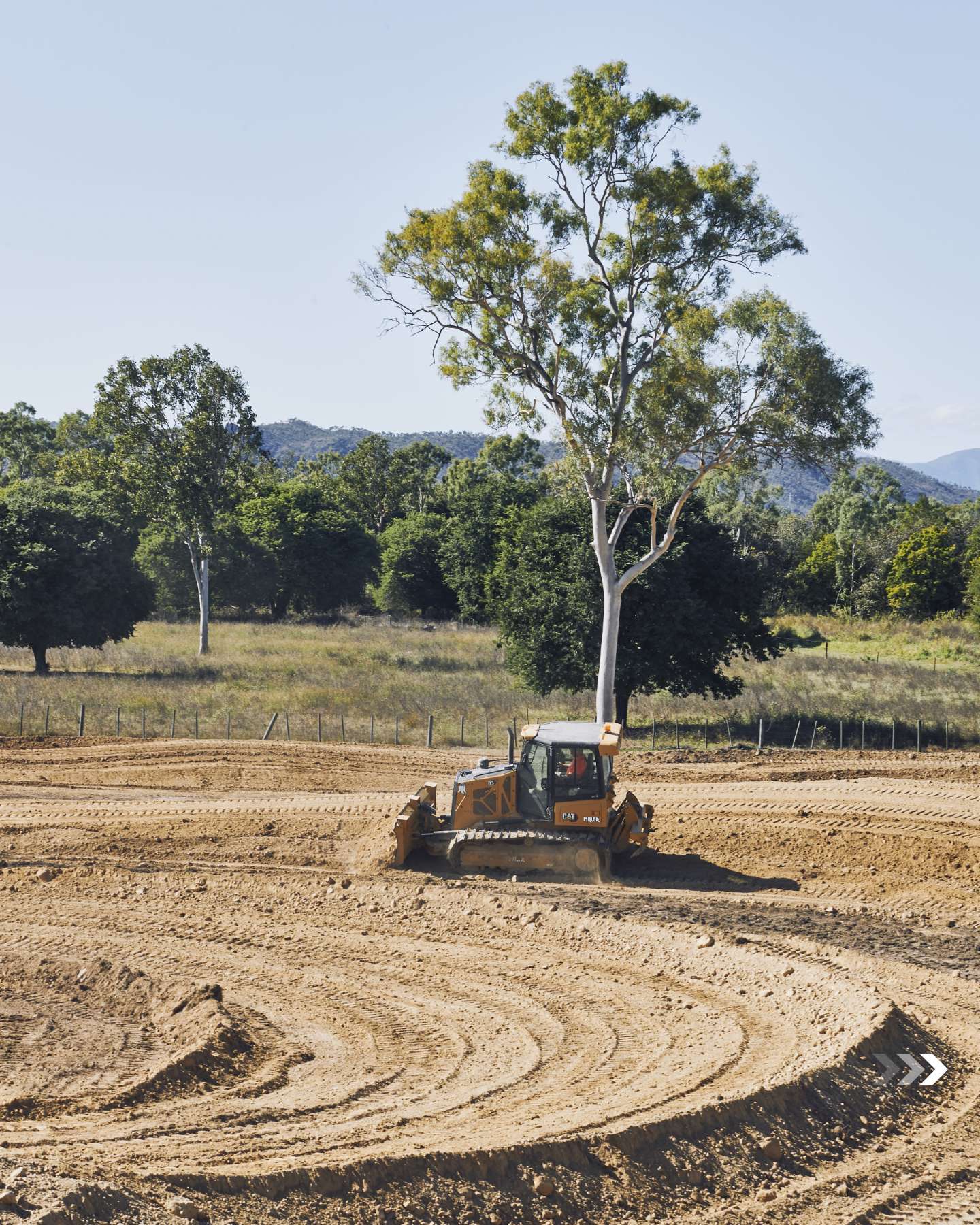 Cat dozer cutting a corner into the track