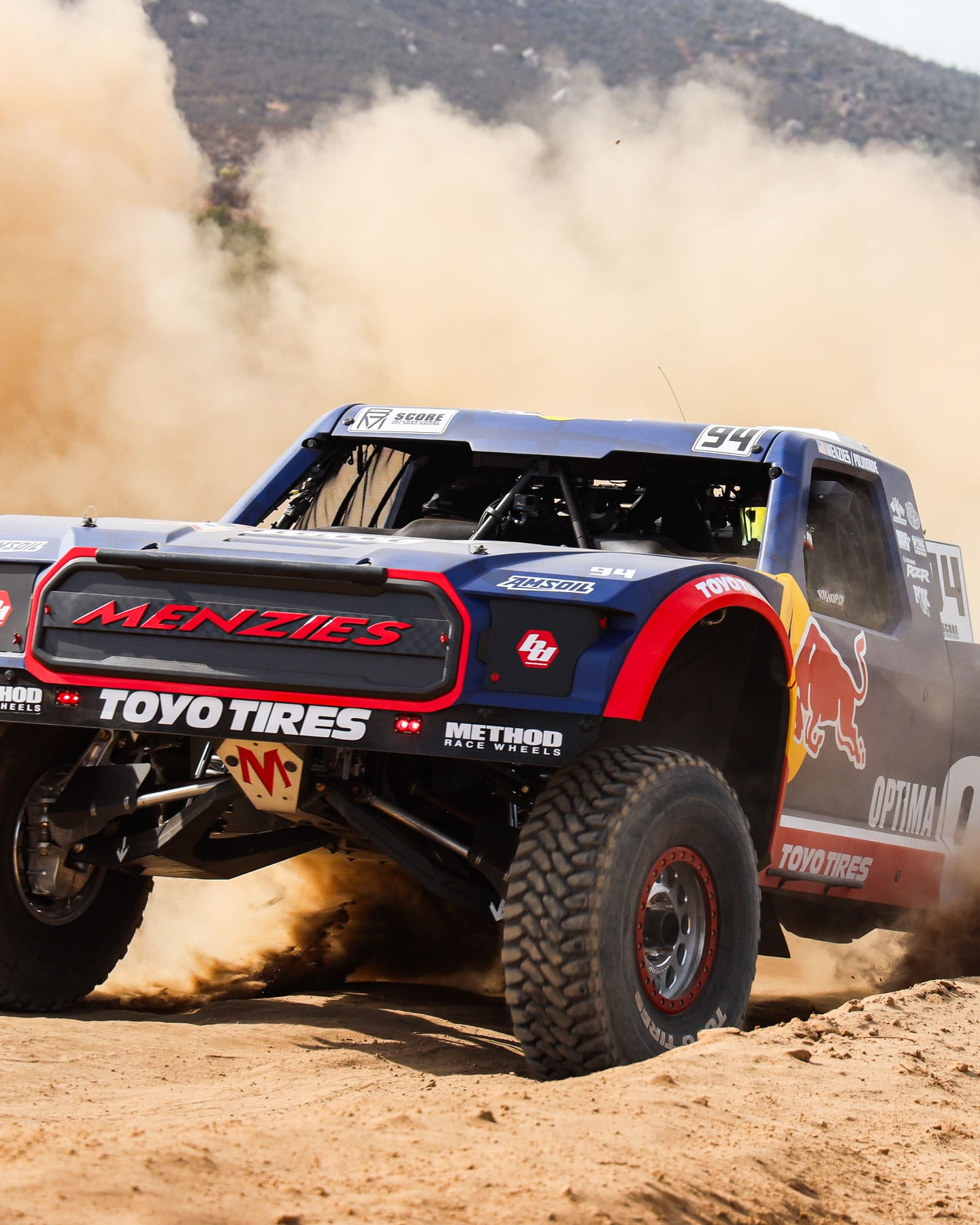The No. 94 Trophy Truck kicking up dust on the Baja 1000 course