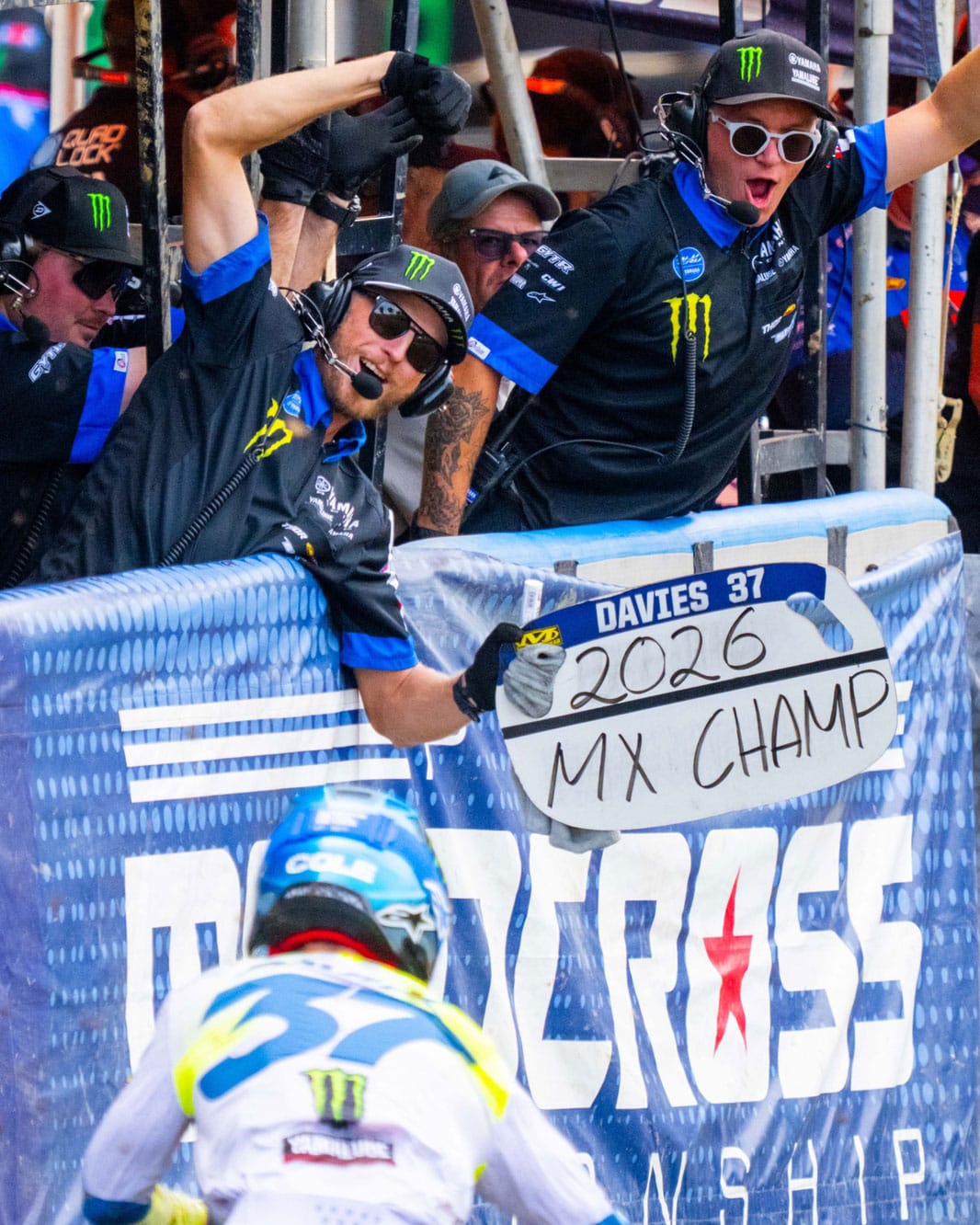 Star Racing crew celebrating with a Davies 2026 MX Champ sign